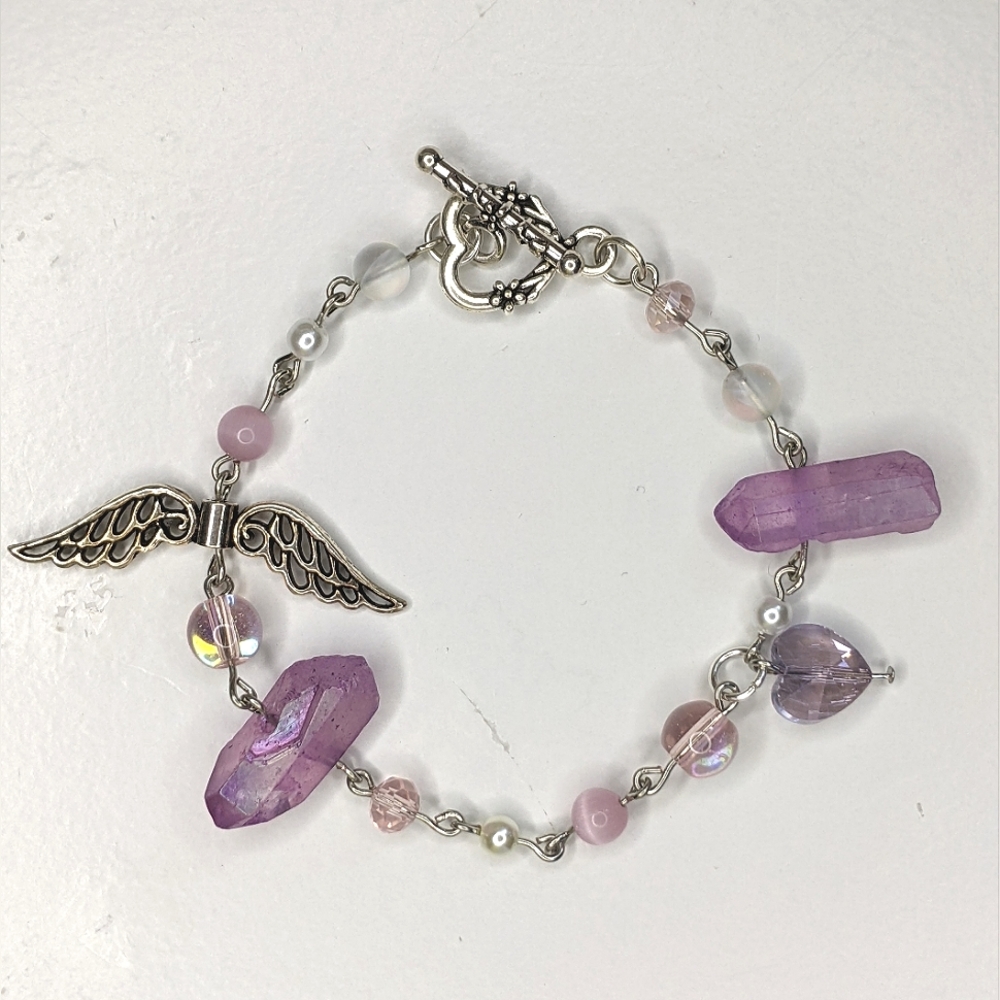 Bracelet with pink and purple crystal beads and a toggle clasp. Handmade by me.